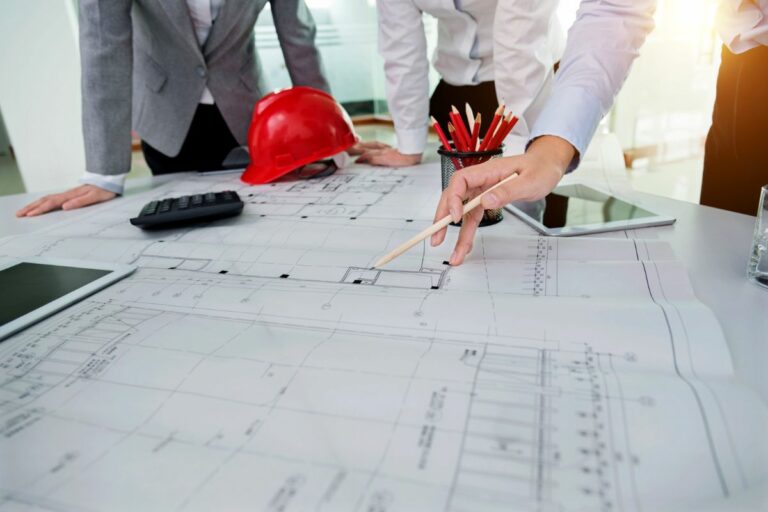 People creating design plans for office building construction