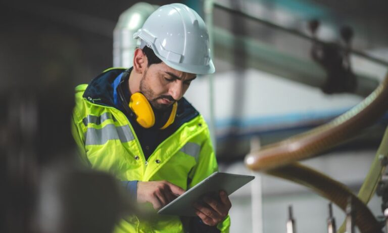 field supervisor looking at ipad in Houston commercial construction